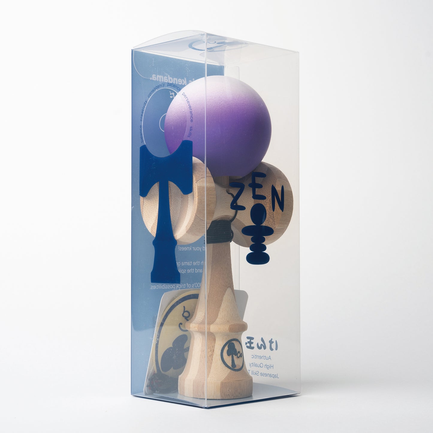 Kendama toy with white to purple fade matte paint in box. Maple ken, beech tama, Kendama Co Zen Shape.