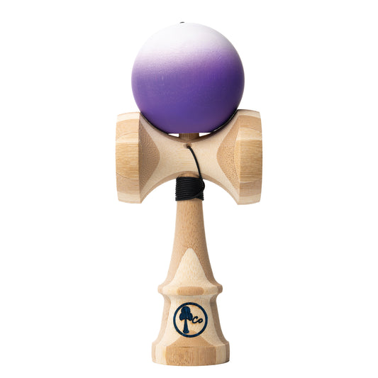 Kendama toy with white to purple fade matte paint. Maple ken, beech tama, Kendama Co Zen Shape.