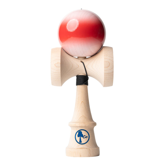 White kendama toy with red fade stripe. Sticky paint, maple ken, beech tama, Kendama Co Zen Shape.